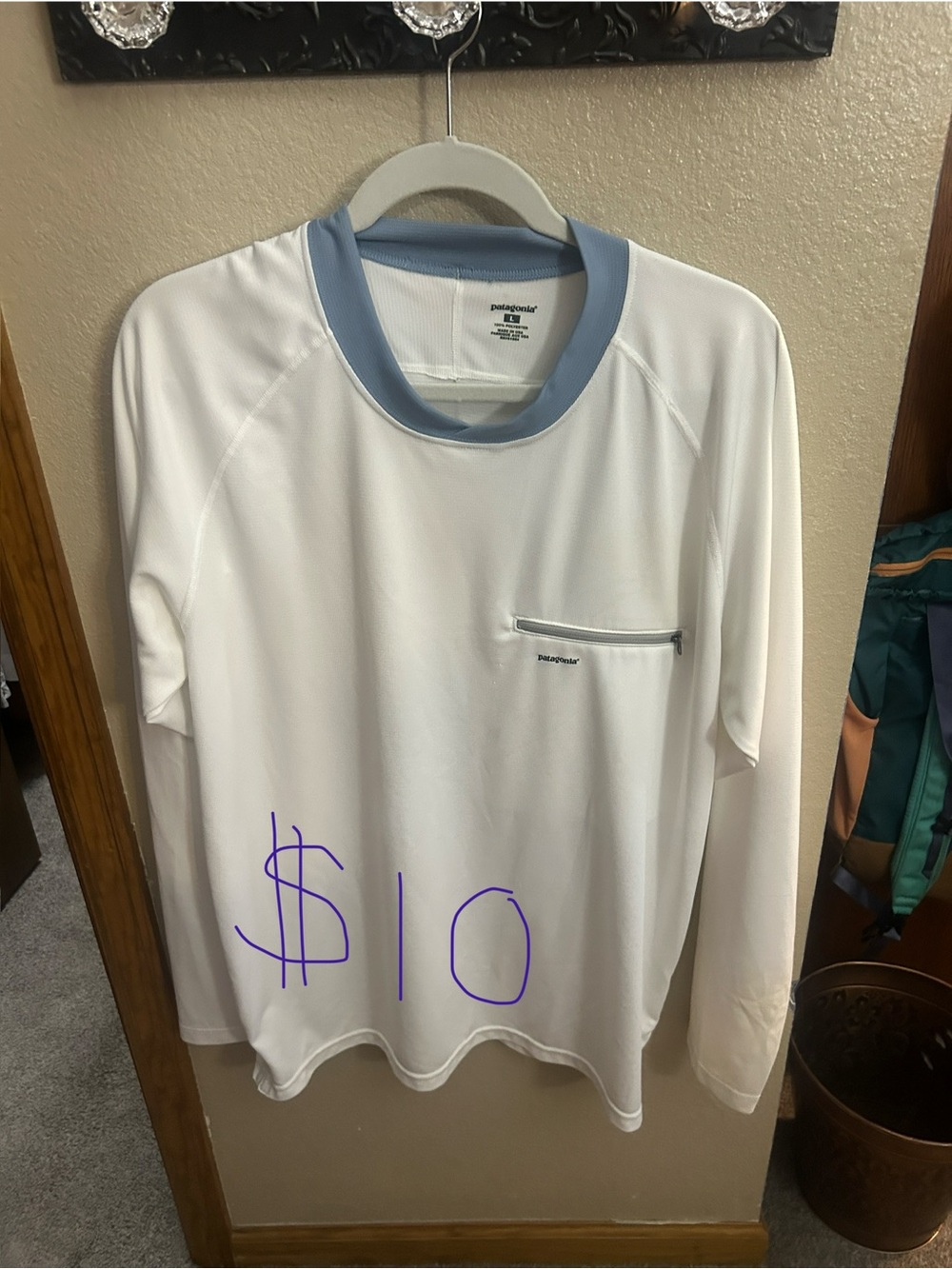 Patagonia Men’s White Long-Sleeve fly fishing shirt with Light Blue Collar